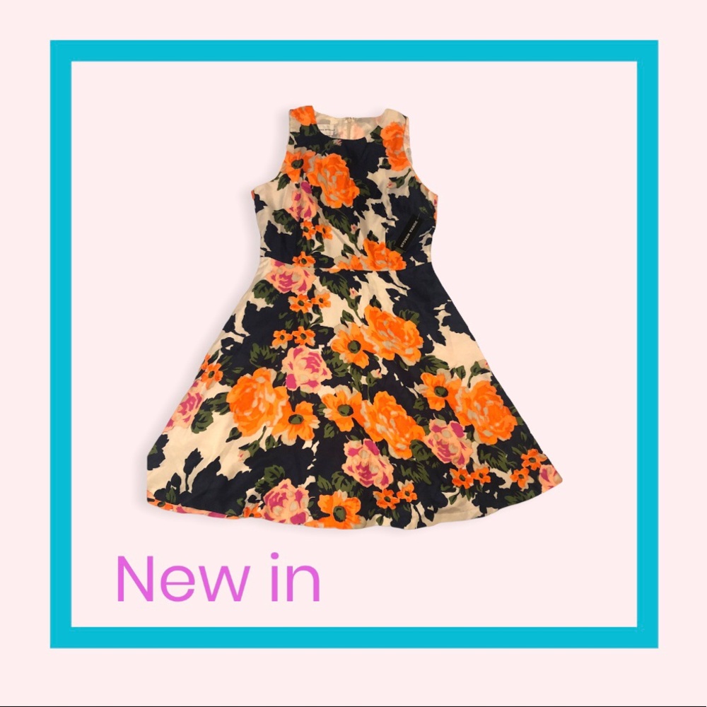 Donna Morgan high quality dress. It’s a flared, floral multi colored dress.